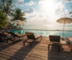 brown wooden lounge chairs on brown wooden dock during daytime