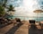brown wooden lounge chairs on brown wooden dock during daytime