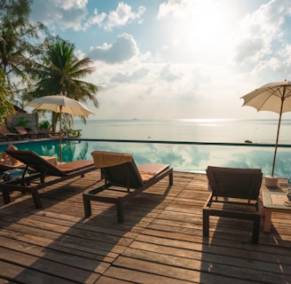 brown wooden lounge chairs on brown wooden dock during daytime