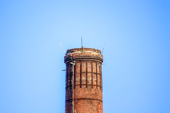 brown brick tower under blue sky in Saint-Nazaire France