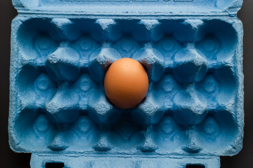 orange fruit on blue surface