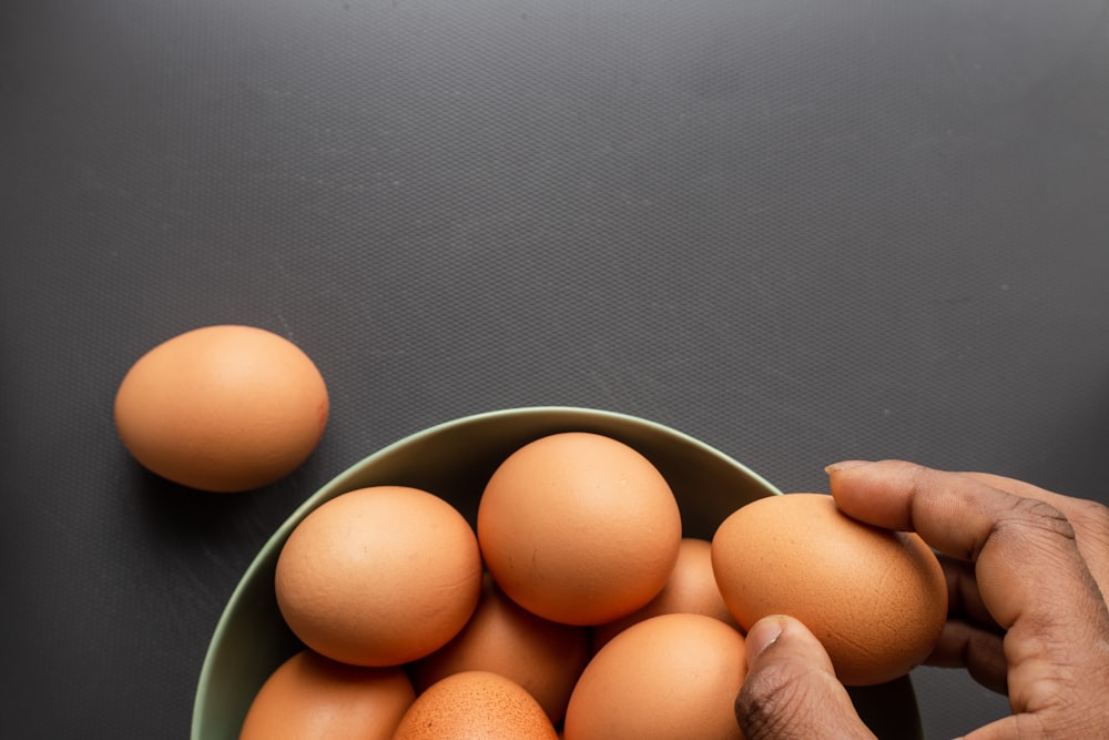 brown eggs in stainless steel bowl