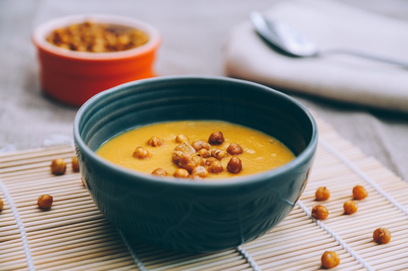 Tunisian lablabi chickpea soup served in a blue ceramic bowl