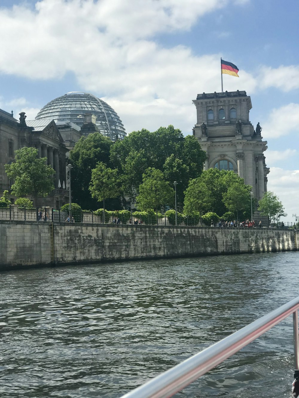 gray concrete building near body of water during daytime