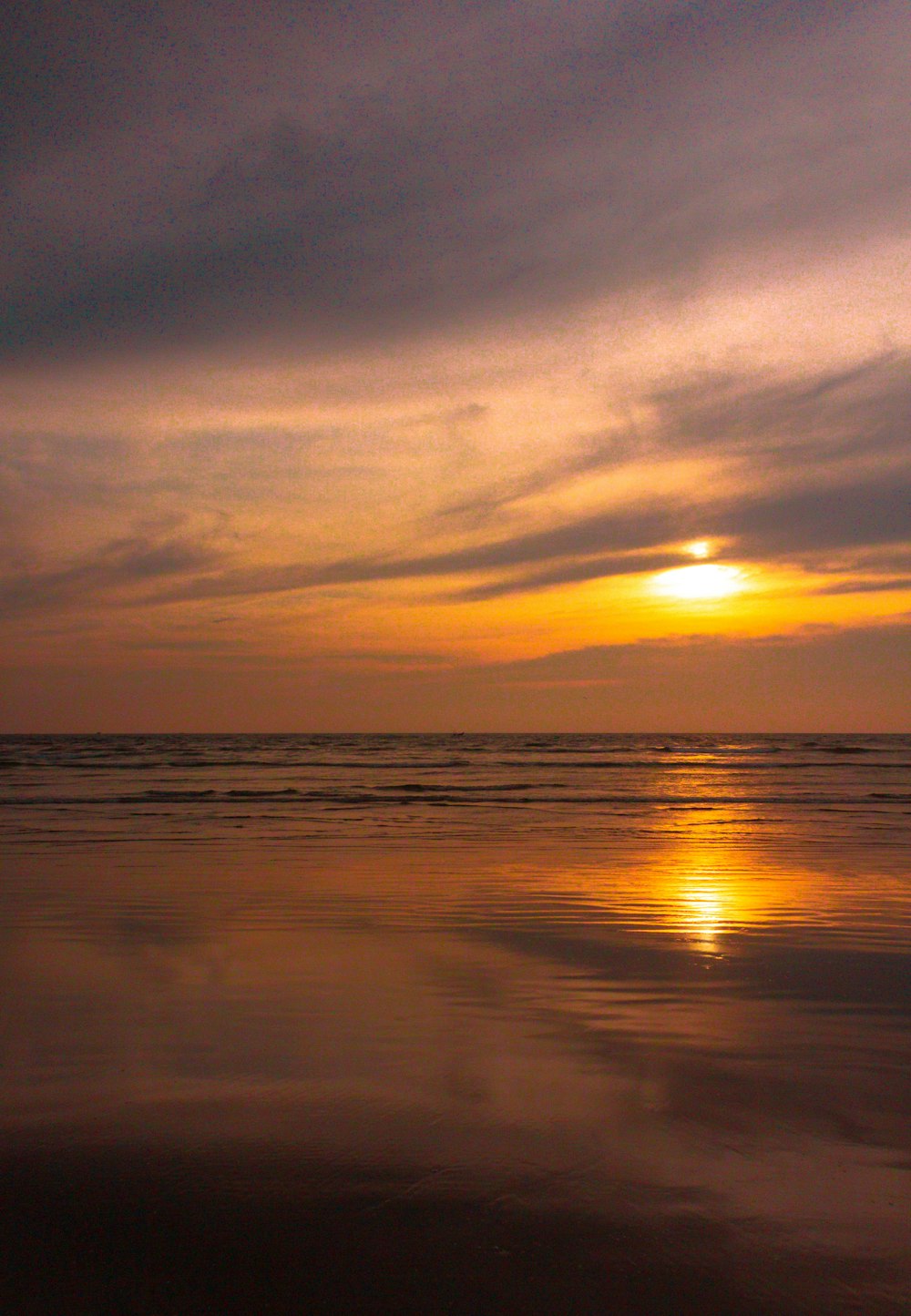 body of water during sunset