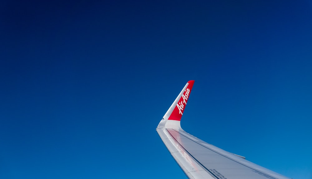 white and red airplane wing