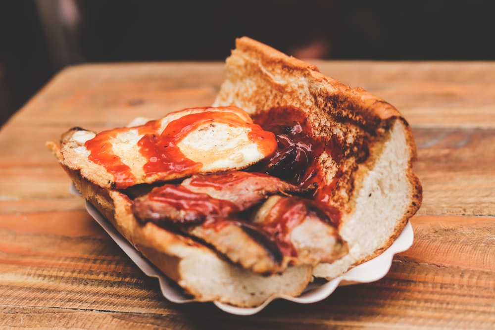 bread with red sauce on brown wooden table