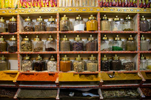 Rows of perfectly sealed spice packets lined up on shelves glowing under warm light