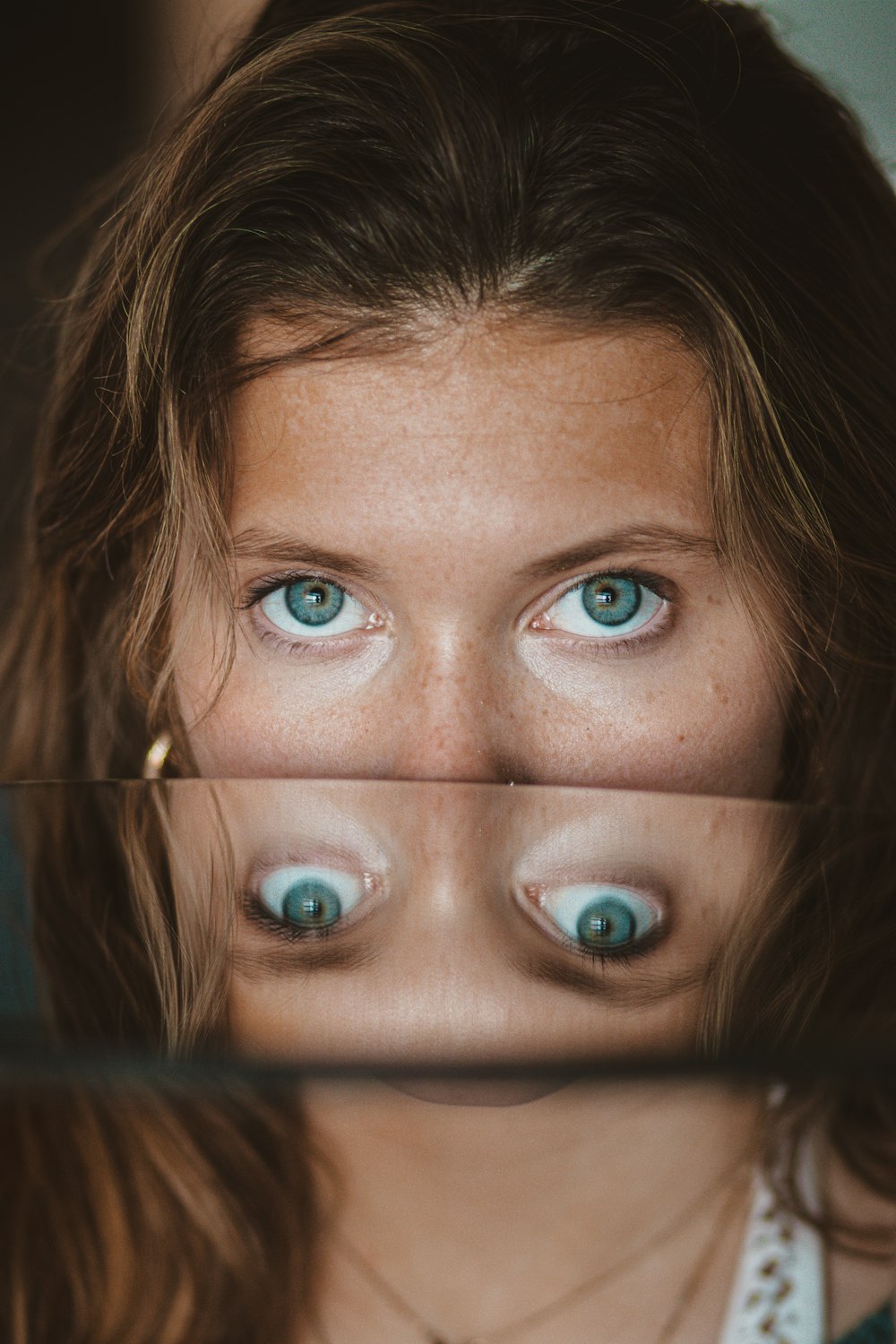 womans face with blue eyes