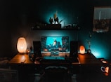 black flat screen computer monitor on brown wooden desk