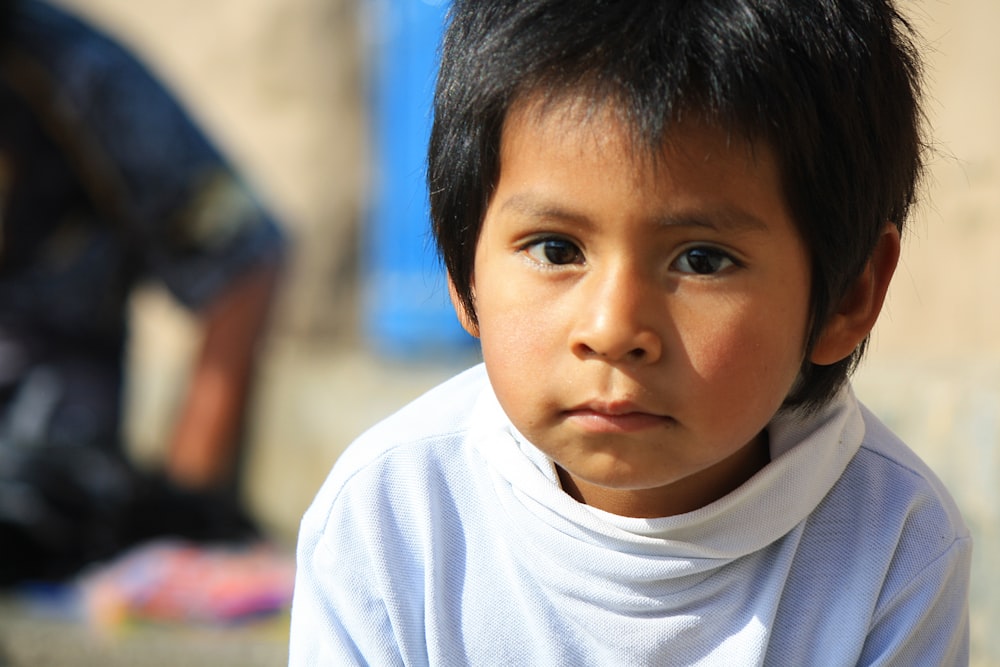 boy in white crew neck shirt