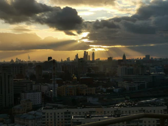 A cinematic still from a recent indie film featuring a dramatic cityscape at dusk.