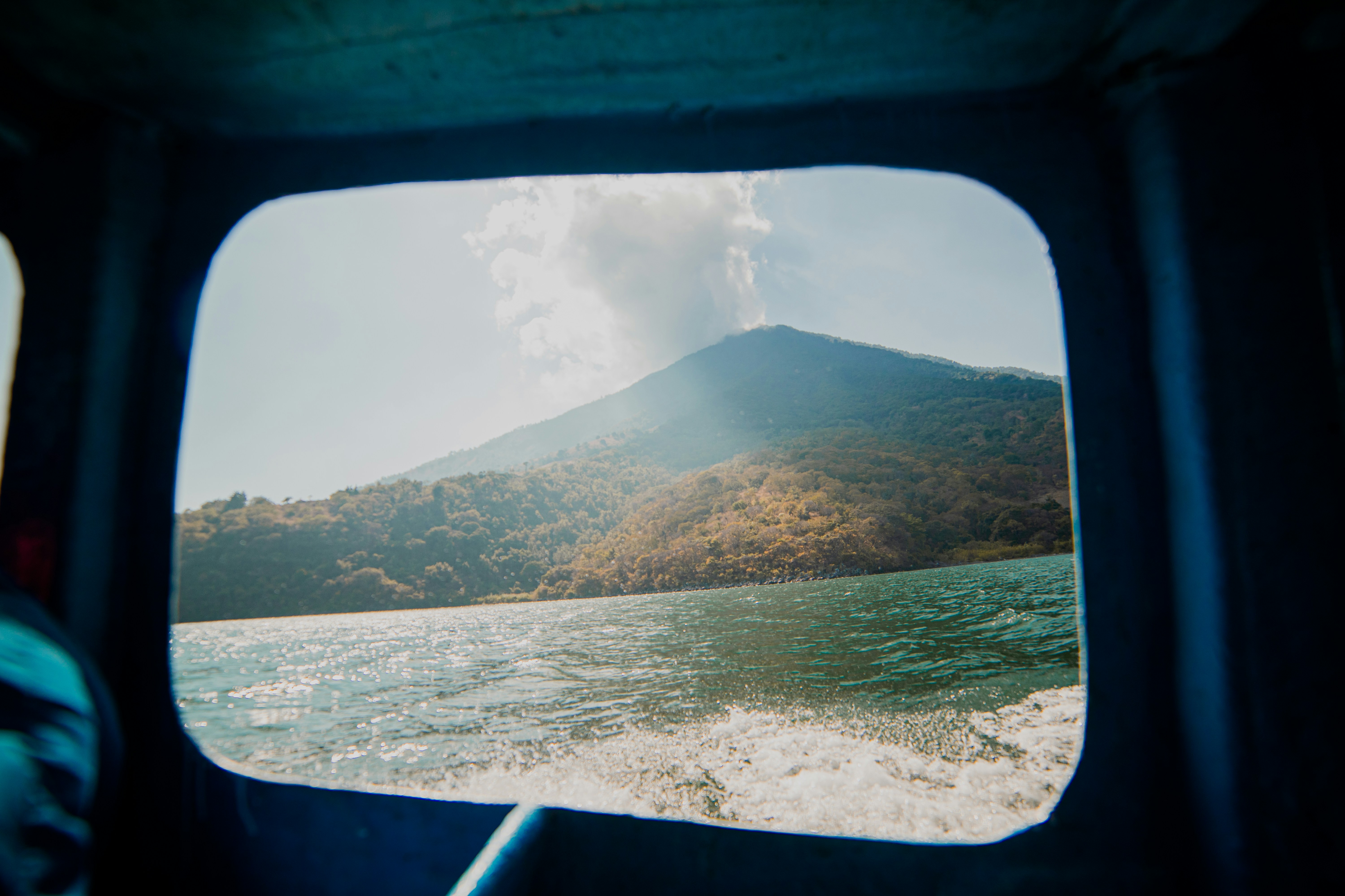 green and brown mountain under white clouds during daytime