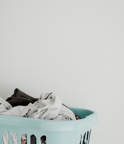 white textile in blue plastic container