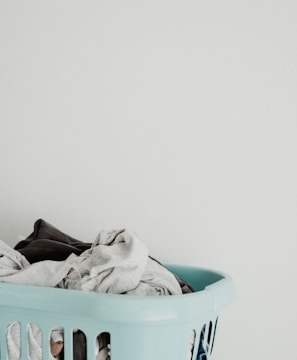 white textile in blue plastic container