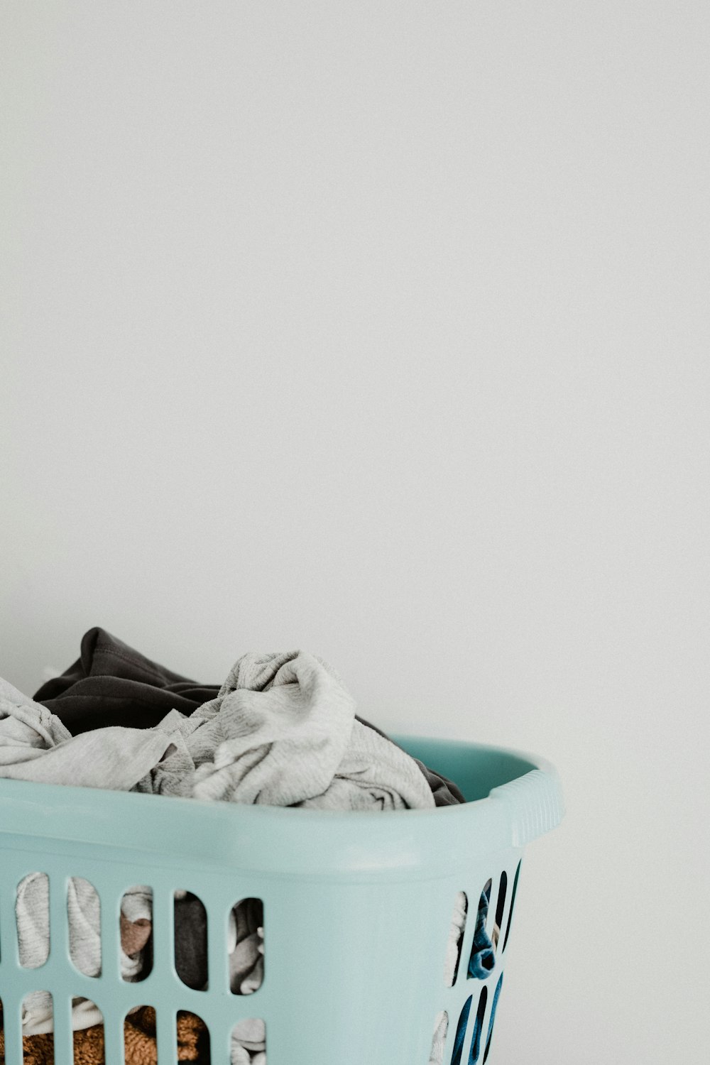 white textile in blue plastic container