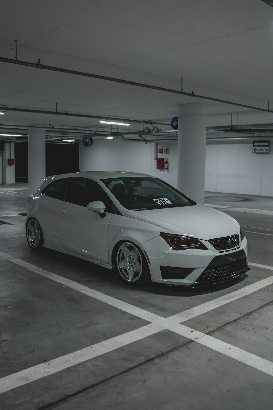 white mercedes benz sedan parked on parking lot