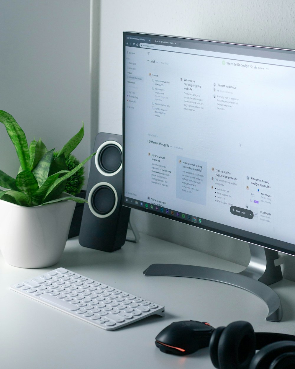 white computer monitor and white keyboard