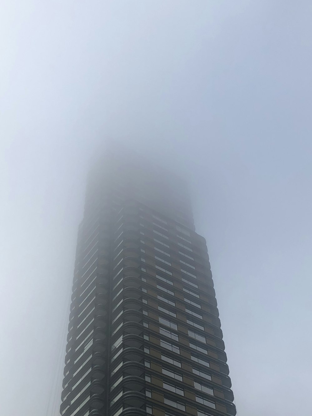 black high rise building under white sky