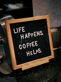 brown wooden frame with black and white quote