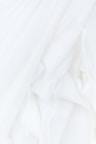 white textile in close up photography