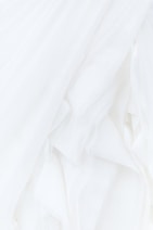 white textile in close up photography