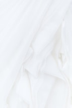 white textile in close up photography
