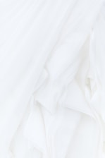 white textile in close up photography