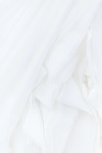 white textile in close up photography