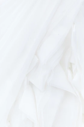 white textile in close up photography
