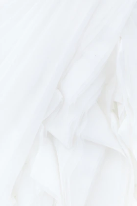 white textile in close up photography