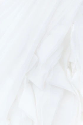 white textile in close up photography