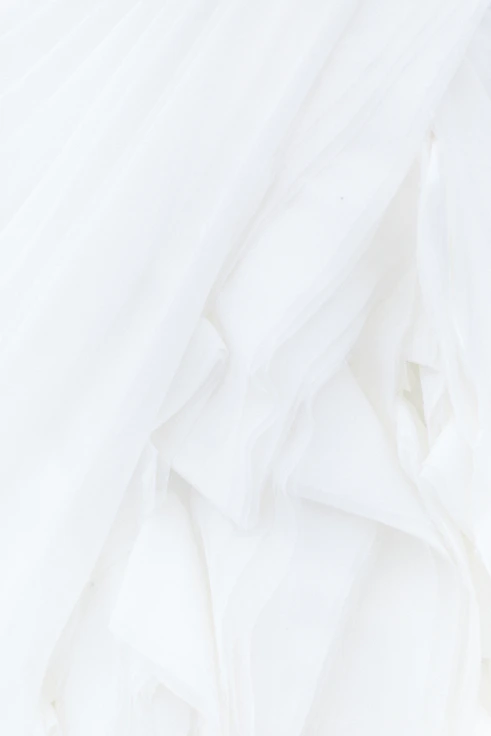 white textile in close up photography