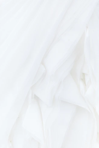 white textile in close up photography