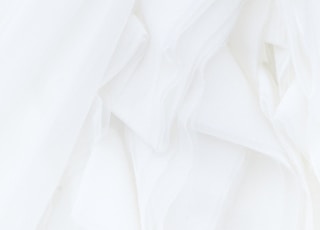 white textile in close up photography