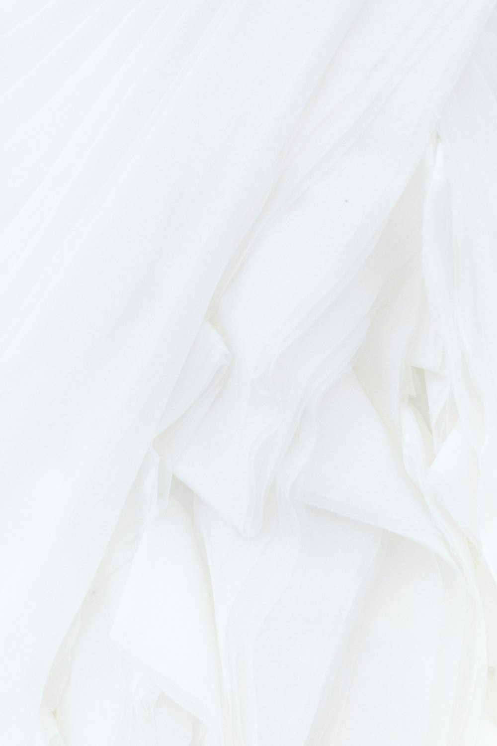 white textile in close up photography