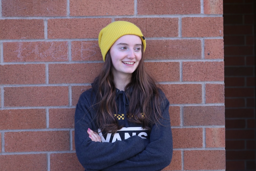 woman in yellow knit cap and blue jacket