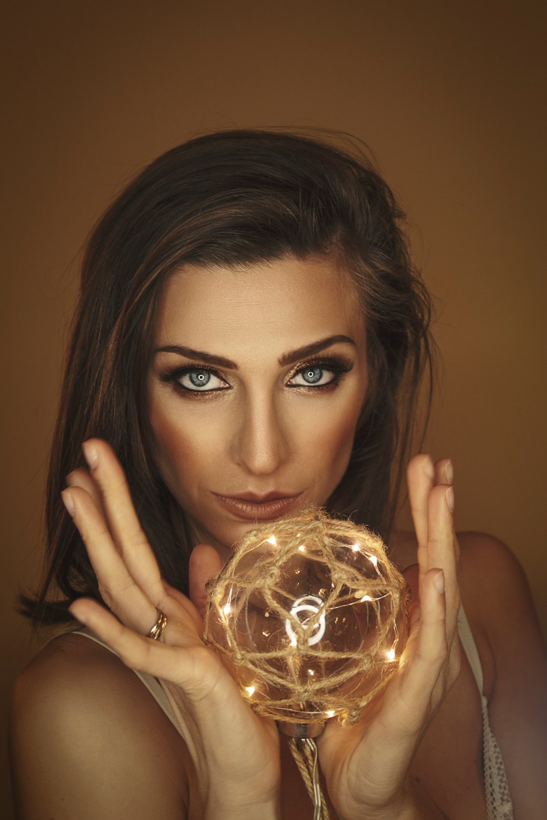 woman holding clear glass ball