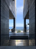 Minimalist architectural detail framing a peaceful ocean view.