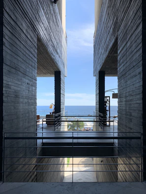Minimalist architectural detail framing a peaceful ocean view.