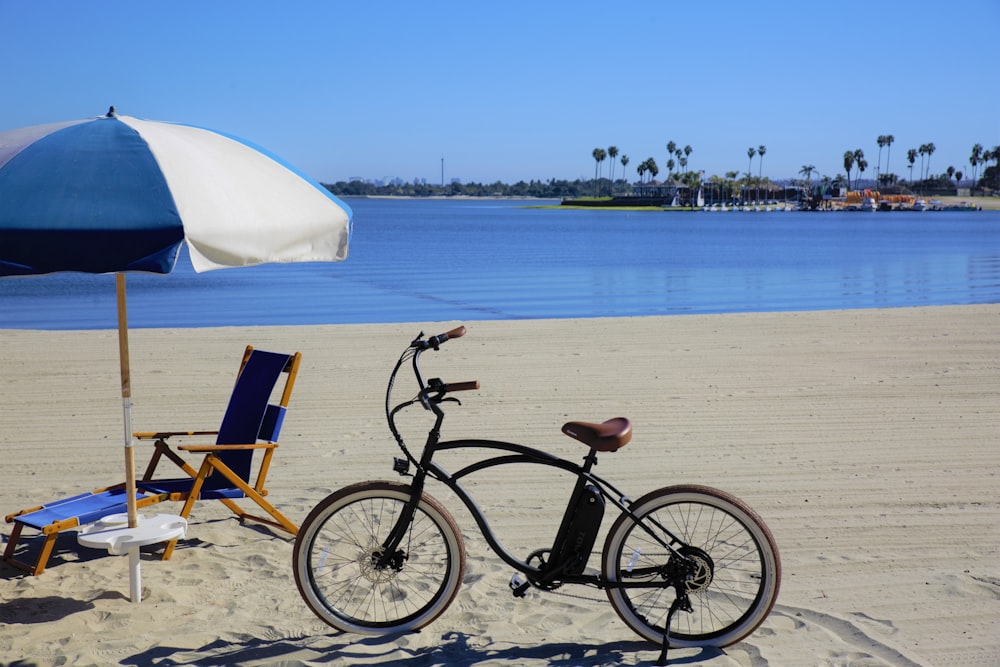 black bicycle on beach during daytime