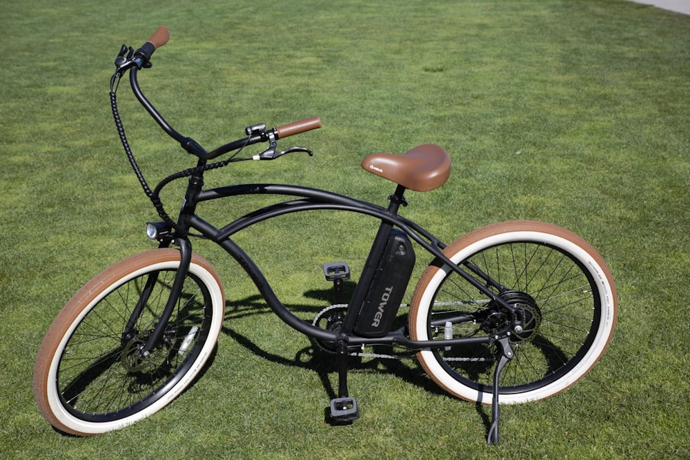 black and orange bicycle on green grass field