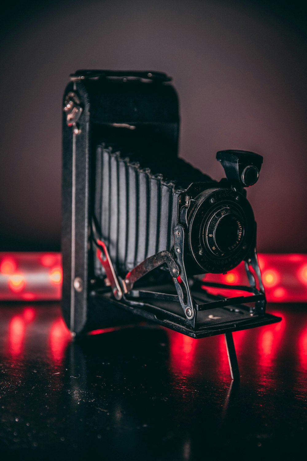 black camera on brown wooden table