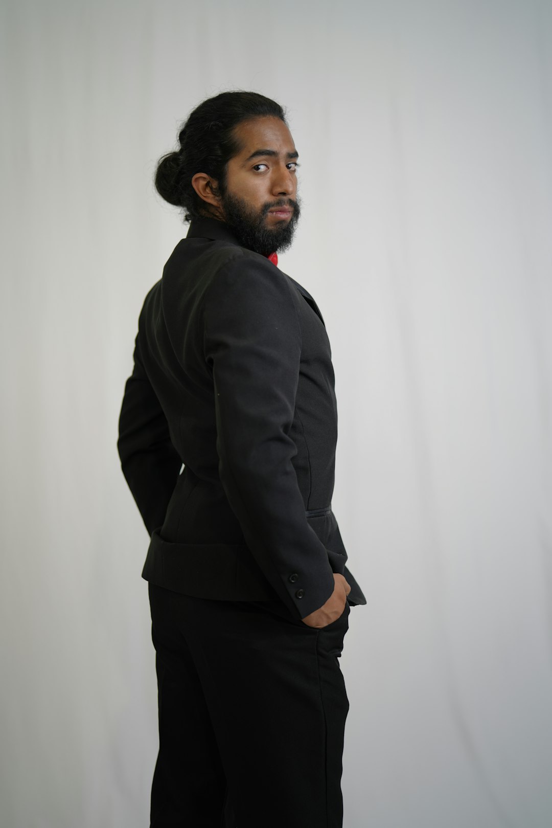 man in black jacket and black pants standing