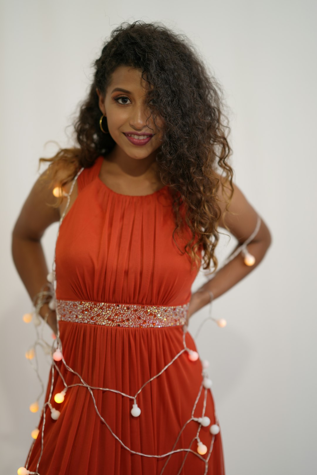 woman in red sleeveless dress