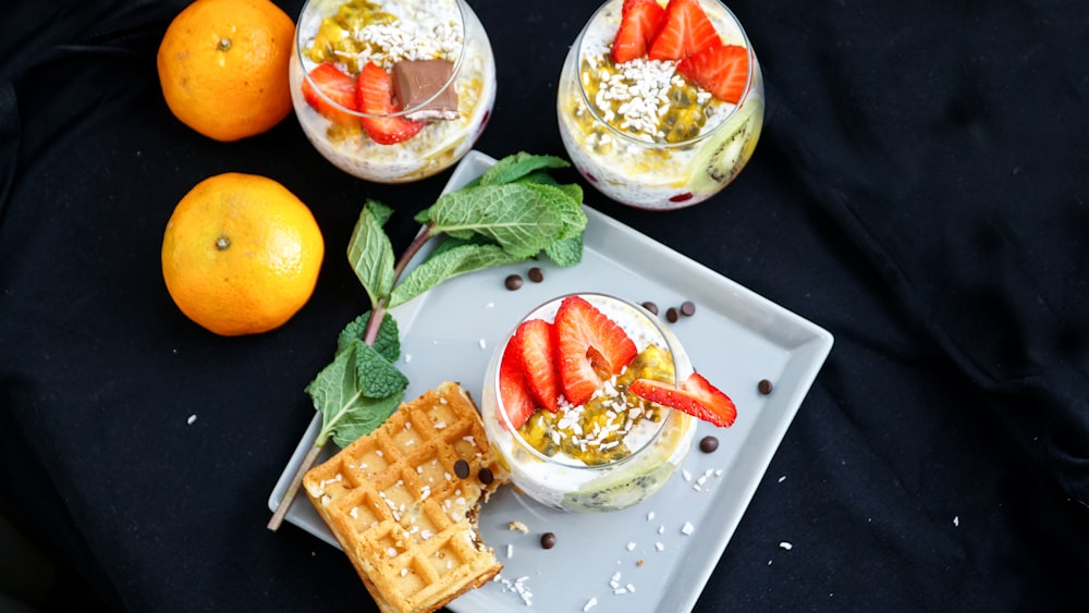 waffle with sliced lemon on white ceramic plate