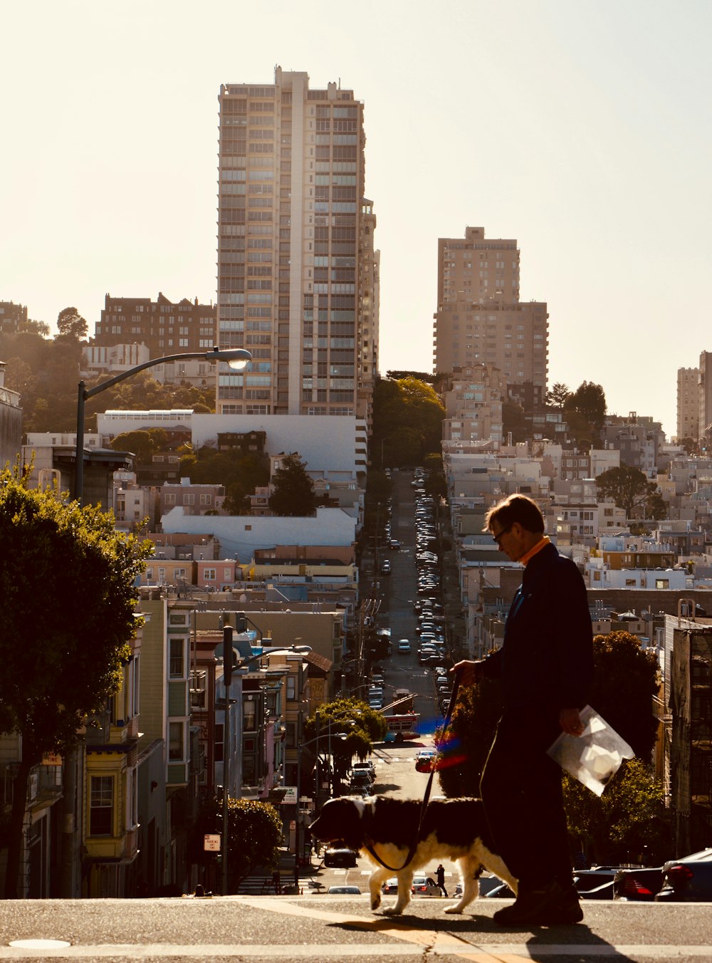 man in black jacket standing on top of building during daytime