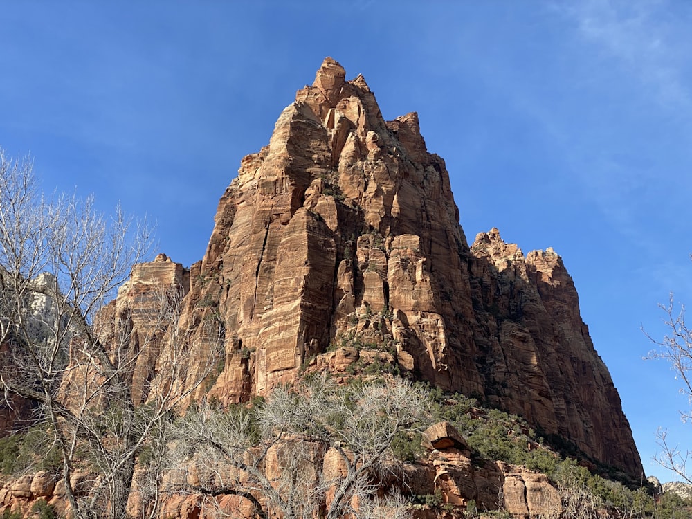 brown rocky mountain under blue sky during daytime