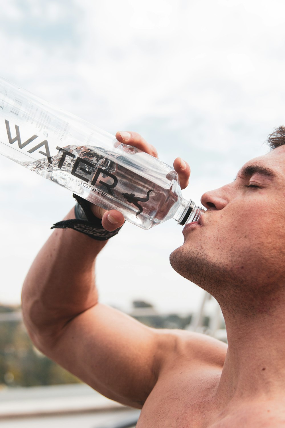 woman drinking water from bottle