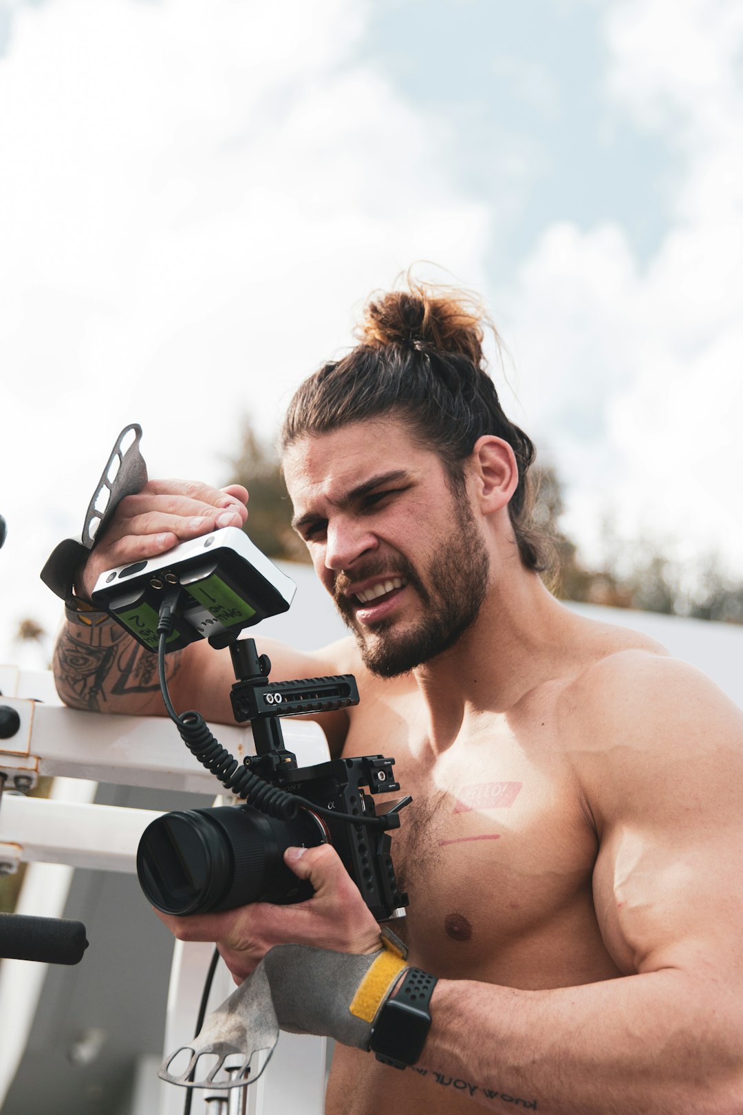 man holding black dslr camera